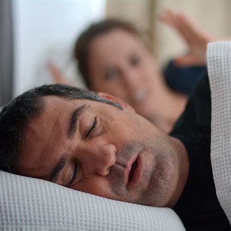 Man sleeping in a bed