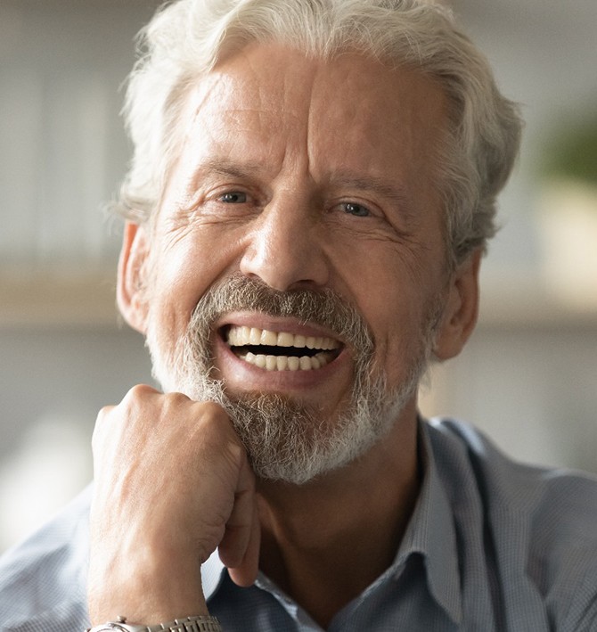a man smiling with dentures in McKinney